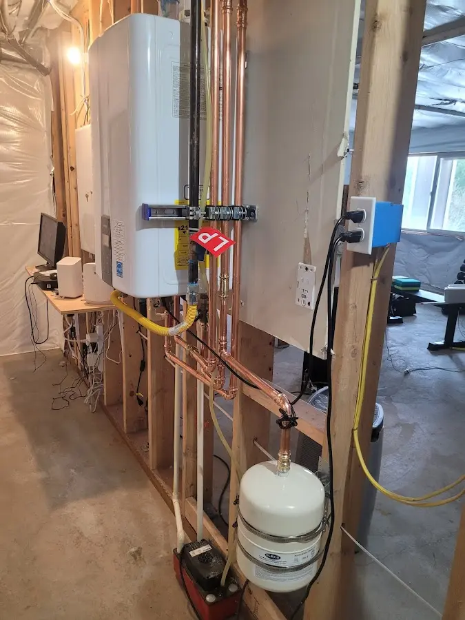 Licensed plumber repairing a kitchen sink in Jackson